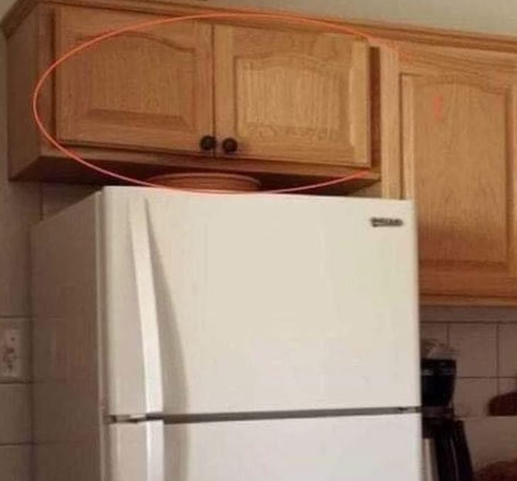 The Real Reason Cabinets Above the Fridge Exist