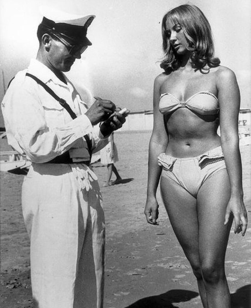 At first glance, it looks like a harmless photo of a woman on the beach but look closer and you’ll see the hidden detail
